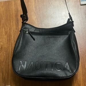 NWOT Nautica crossbody purse. Front zip pocket zip inside pocket a zip closure.